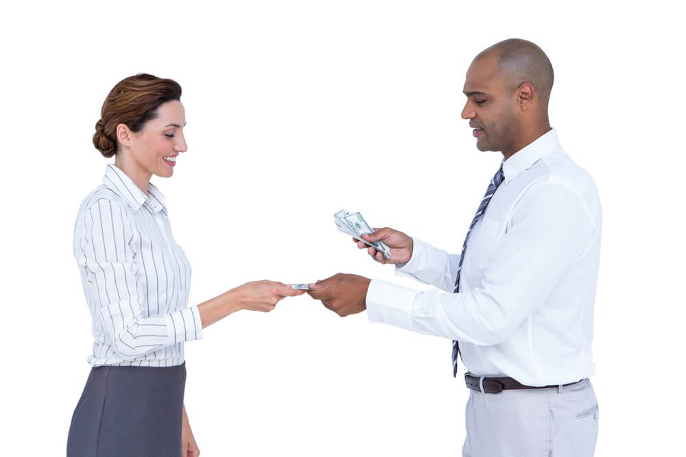 Business people exchanging bank notes on white background.jpeg