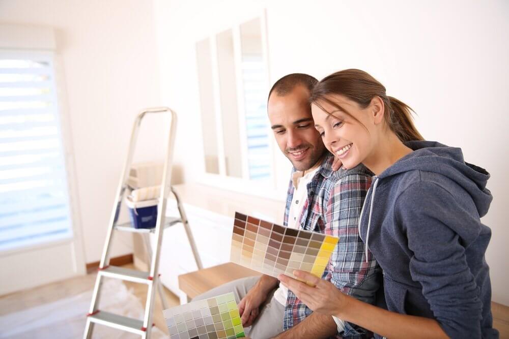 Couple in new house choosing color for walls.jpeg