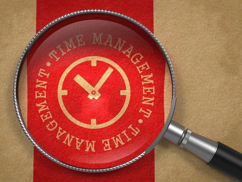 Magnifying Glass with Time Management Written Arround Icon of Clock Face on Old Paper with Red Vertical Line Background. Business Concept..jpeg
